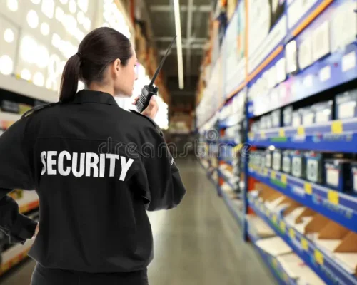 security-guard-using-portable-radio-transmitter-shopping-mall-space-text-180022942